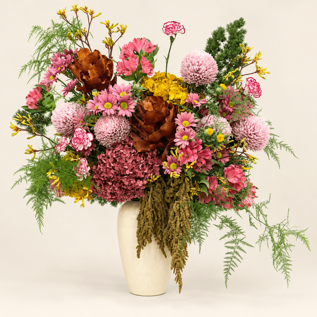 Dar Al Ward floral arrangement in an ivory vase