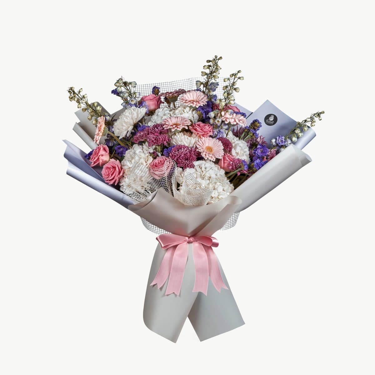 Flower Corner bouquet with pink gerberas, white flowers and a pink ribbon