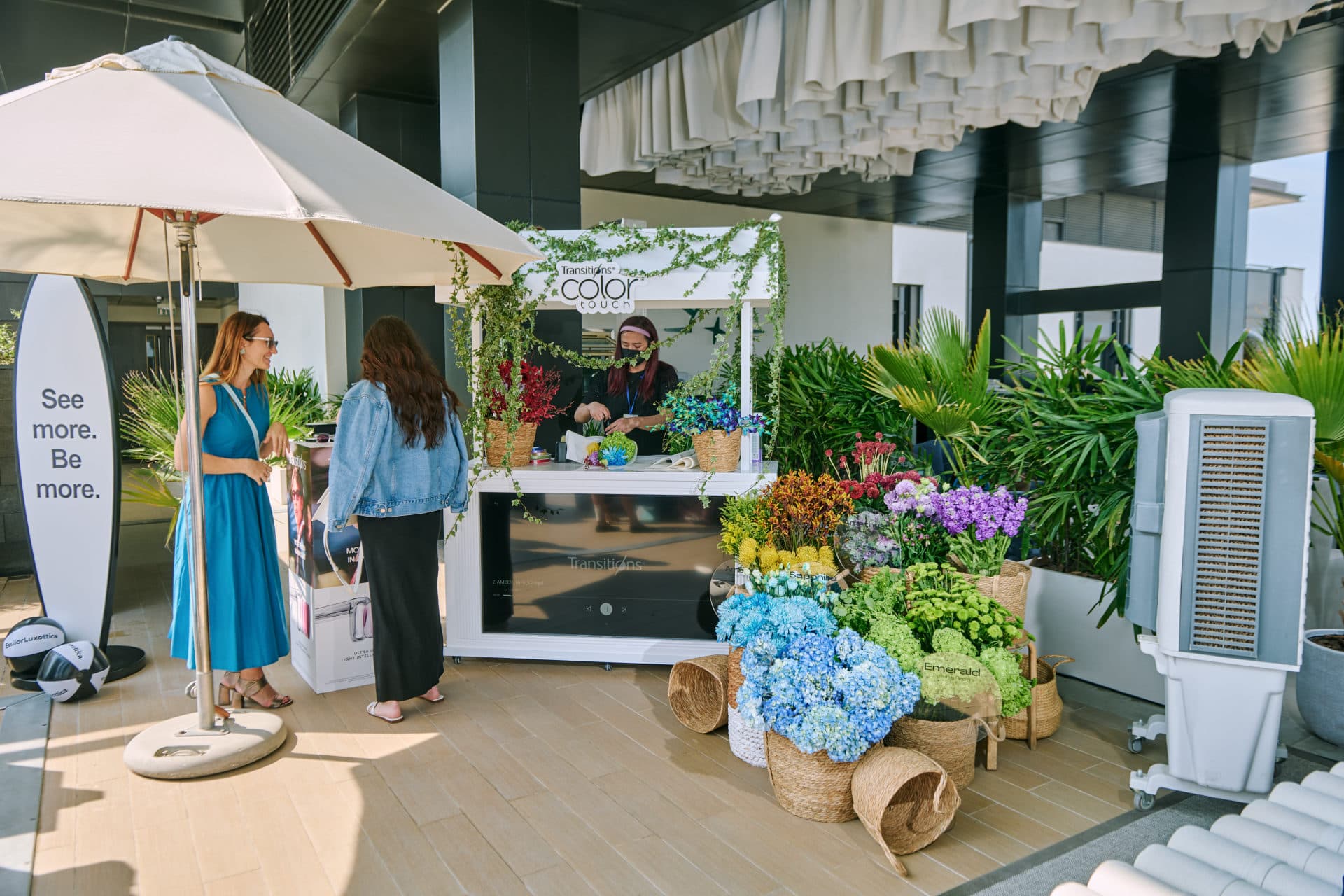 Flower Corner flower cart serving guests at a Dubai outdoor brand event — photo 720