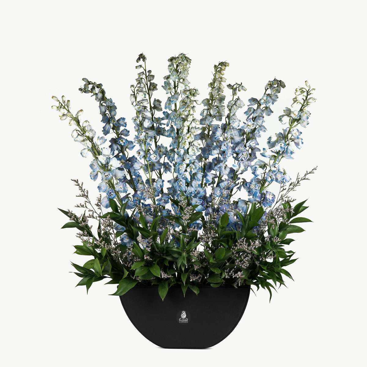 Leather base flower arrangement with serene blue and white flowers