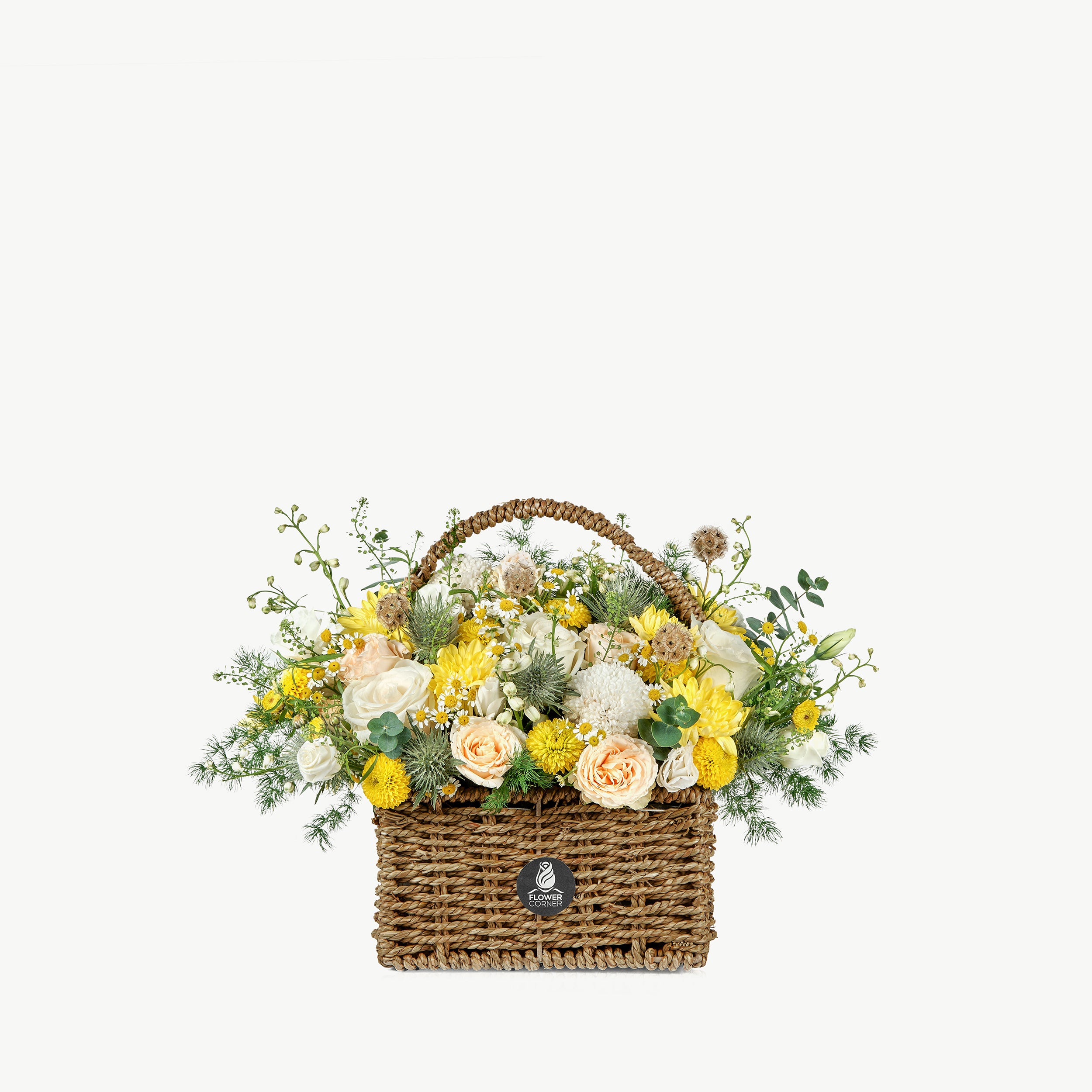 Bloom Bliss flower basket with yellow and peach seasonal flowers and greenery